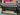 Epson large-format printer with a colorful abstract painting in the background